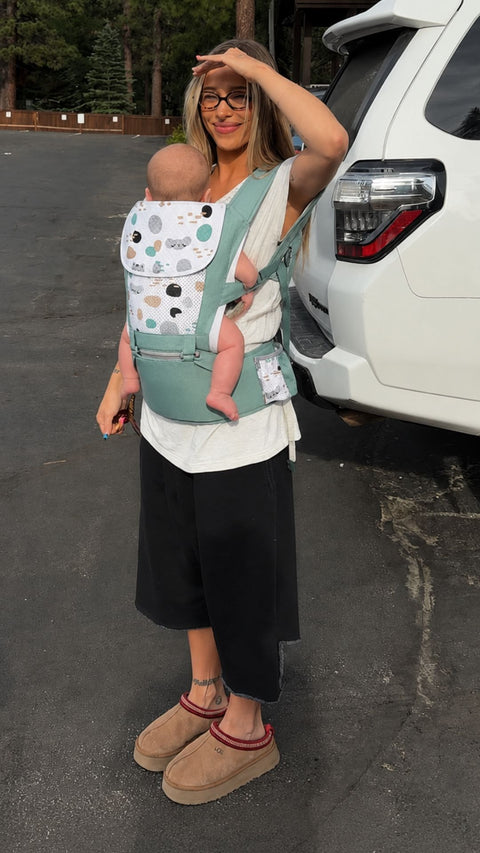A mom wearing Grow+ in green outdoors